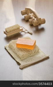 massager hairbrush and soap on bast