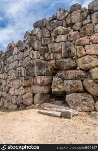 Massive boulders form the walls of the fortress and palace of Tiryns in Greece. Ancient Greek historic site of Tiryns in Peloponnese Greece