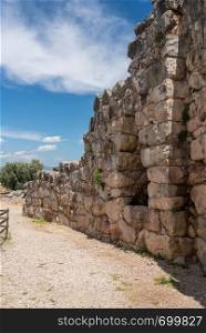 Massive boulders form the walls of the fortress and palace of Tiryns in Greece. Ancient Greek historic site of Tiryns in Peloponnese Greece