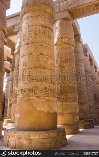 massive columns. Luxor, Egypt. old egypt hieroglyphs carved on the stone