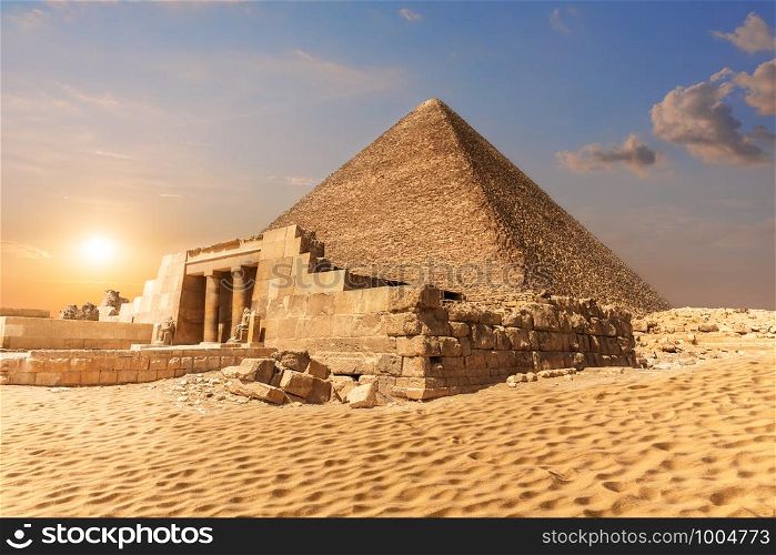 Mastaba of Seshemnefer IV and the Pyramid of Cheops in Giza.. Mastaba of Seshemnefer IV and the Pyramid of Cheops in Giza