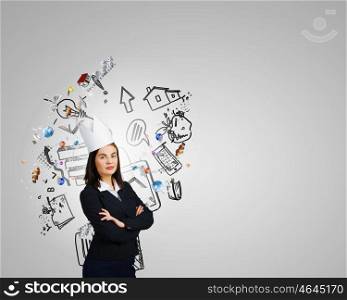 Master of creativity. Young businesswoman in paper crown and speech balloon in hand