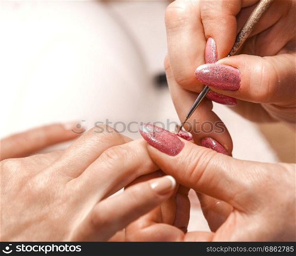 Master of manicure paints nails