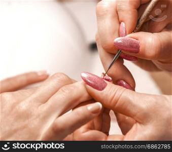 Master of manicure paints nails