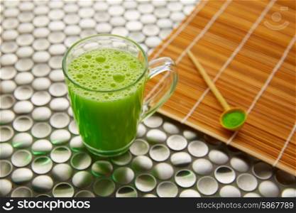 Matcha green tea from Japan on modern stainless steel background