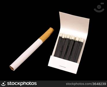 Matches and cigarette on black
