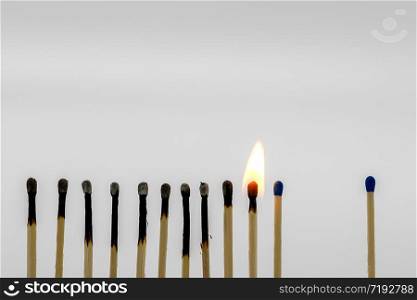 Matches in a row close together ignite one another, one with a greater distance remains intact
