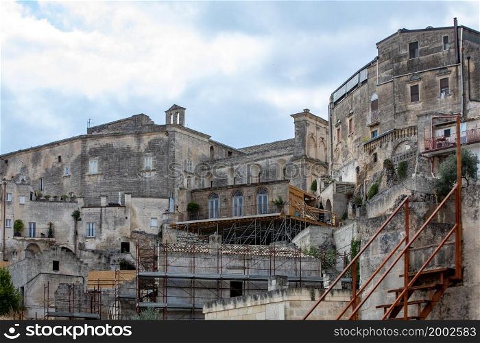 " Matera, Italy - Sept 15, 2019: Bond apartment from the movie "No Time to Die" in Sassi, Matera, Italy. Fictional hotel in the Piazzetta Pascoli area built especially for the production, with views looking down on the town of Matera. Once the filming is wrapped, the construction will disappear and will probably confuse tourists for years to come that they can not find the building.. Bond apartment from the movie "No Time to Die" in Sassi, Matera, Italy."