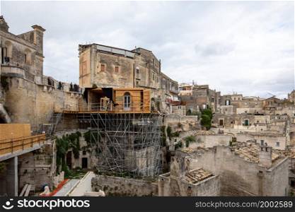 " Matera, Italy - Sept 15, 2019: Bond apartment from the movie "No Time to Die" in Sassi, Matera, Italy. Fictional hotel in the Piazzetta Pascoli area built especially for the production, with views looking down on the town of Matera. Once the filming is wrapped, the construction will disappear and will probably confuse tourists for years to come that they can not find the building.. Bond apartment from the movie "No Time to Die" in Sassi, Matera, Italy."