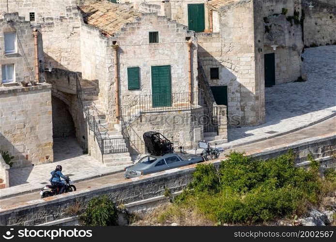 "Matera, Italy - September 15, 2019: Bond 25, Aston Martin DB5 while filming chase scenes through the narrow streets of the movie "No Time to Die" in Sassi, Matera, Italy.. Aston Martin DB5 while filming chase scenes through the narrow streets of the movie "No Time to Die" in Sassi, Matera, Italy."