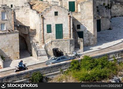"Matera, Italy - September 15, 2019: Bond 25, Aston Martin DB5 while filming chase scenes through the narrow streets of the movie "No Time to Die" in Sassi, Matera, Italy.. Aston Martin DB5 while filming chase scenes through the narrow streets of the movie "No Time to Die" in Sassi, Matera, Italy."