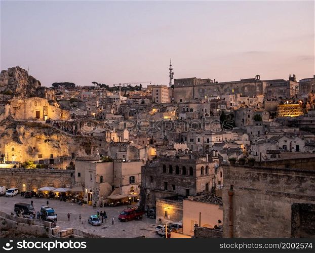"Matera; Italy - September 17; 2019: Bond 25. Scene of a procession with extras carrying candles. from the movie "No Time to Die" in Sassi; Matera; Italy.. Bond 25. Scene of a procession with extras carrying candles. from the movie "No Time to Die" in Sassi; Matera; Italy."