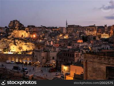 "Matera; Italy - September 17; 2019: Bond 25. Scene of a procession with extras carrying candles. from the movie "No Time to Die" in Sassi; Matera; Italy.. Bond 25. Scene of a procession with extras carrying candles. from the movie "No Time to Die" in Sassi; Matera; Italy."