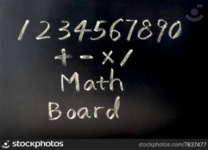 Math board with numbers written with chalk