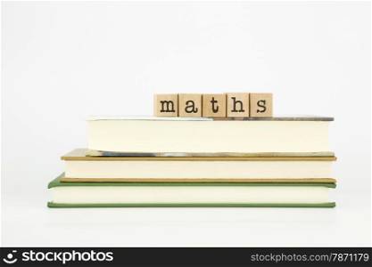 maths word on wood stamps stack on books