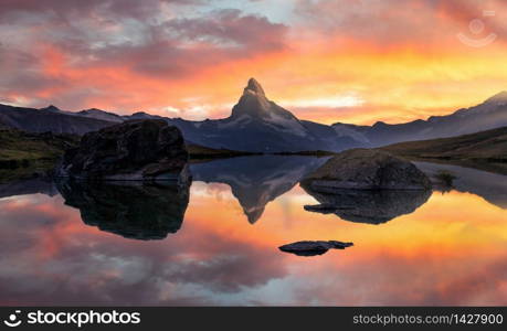 Matterhorn or Cervino reflection on lake stellisee in Zermatt in the mountains in the swiss Alps, Switzerland.