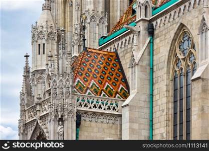 Matthias church in Hungarian Budapest with architectonic details and colorful roof slates. Matthias church in Hungarian Budapest with architectonic details