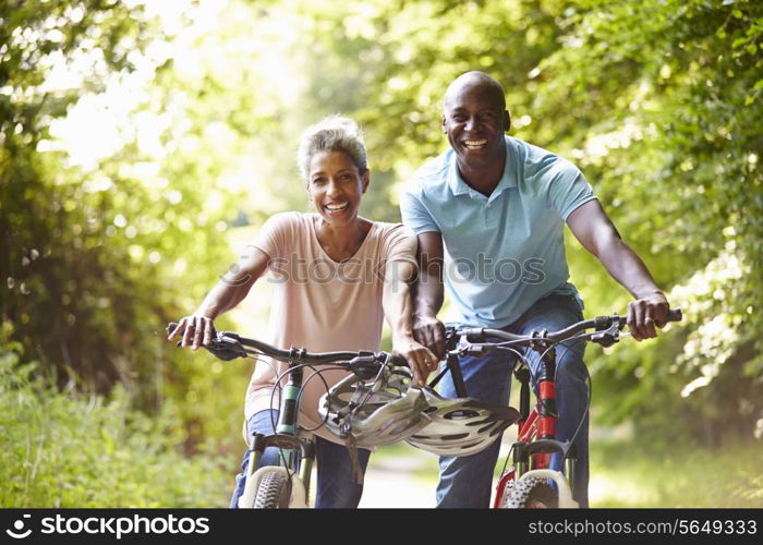 Mature African American Couple On Cycle Ride In Countryside