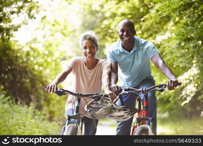 Mature African American Couple On Cycle Ride In Countryside