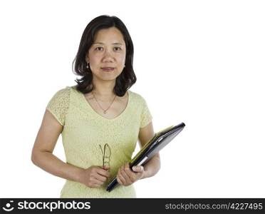 Mature Asian women holding notebook, pen and glasses on white background
