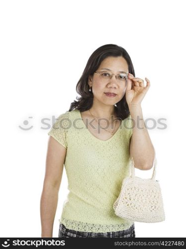Mature Asian women with glasses and purse on white background