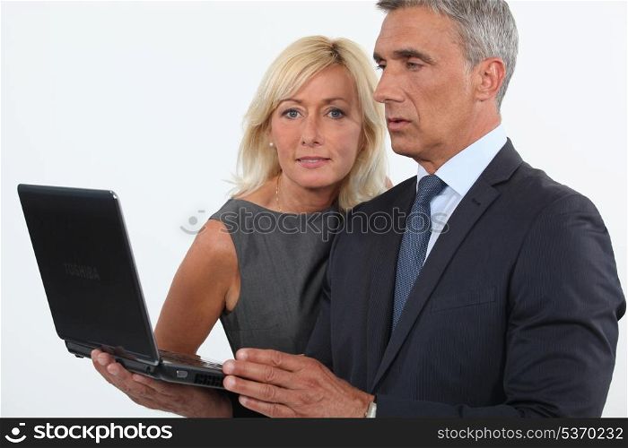 mature business couple posing