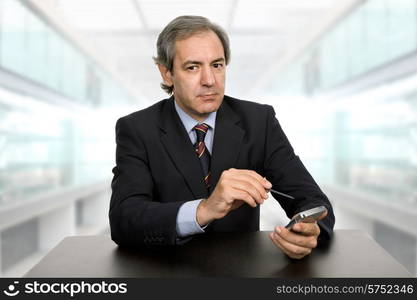 mature business man on a desk at the office