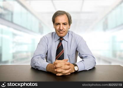 mature business man on a desk at the office