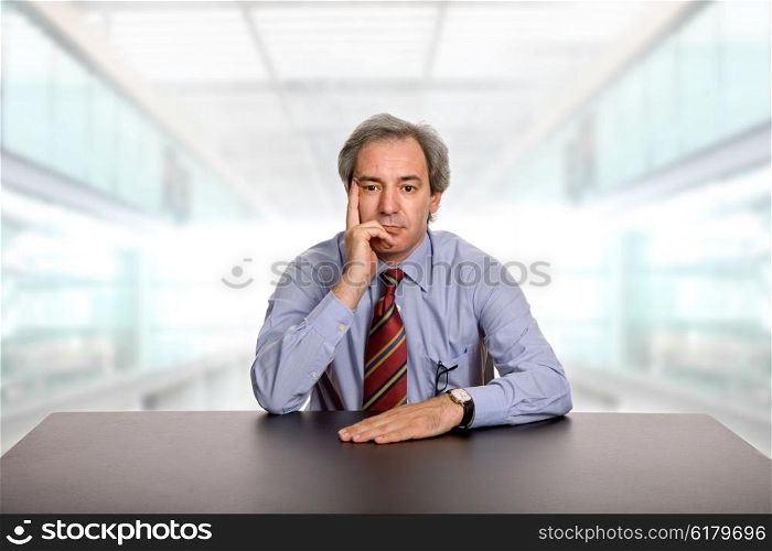mature business man on a desk at the office