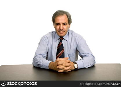 mature business man on a desk, isolated on white