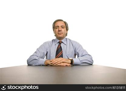 mature business man on a desk, isolated on white