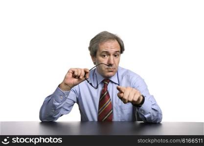 mature business man on a desk pointing, isolated