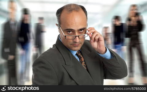 mature business man thinking taking off his glasses