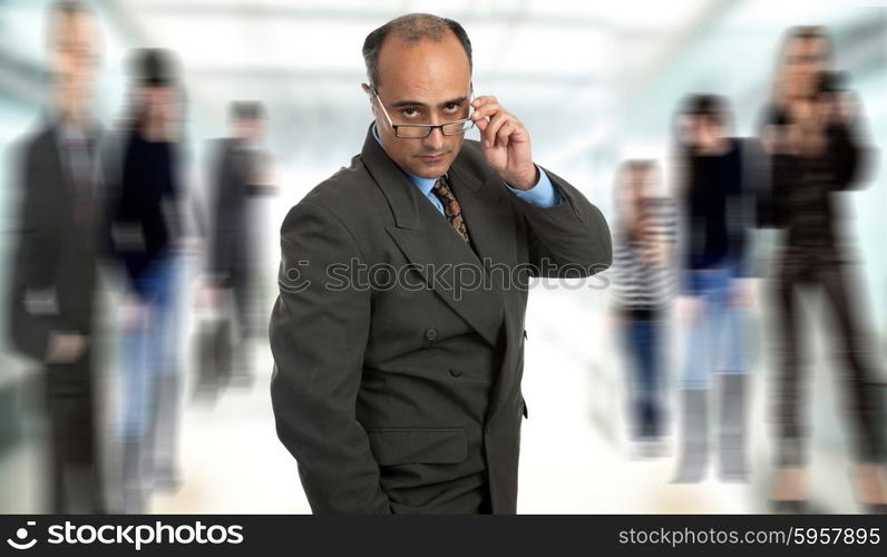 mature business man thinking taking off his glasses