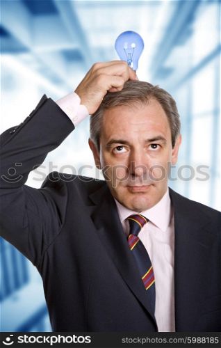 mature business man with a lamp in the top of the head