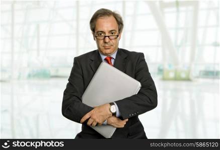 mature business man with his laptop at the office