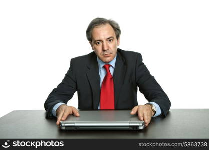 mature business man with his laptop on a desk