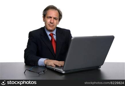 mature business man working with his laptop, isolated