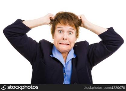 Mature business woman overwhelmed with frustration, pulling her hair. Isolated on white.