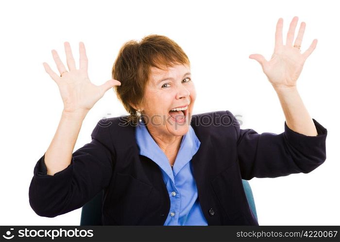 Mature business woman throwing up her hands in excitement. Isolated on white.