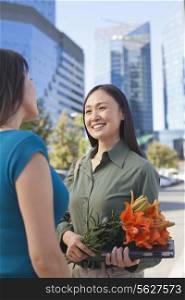 Mature Business Woman With Flowers