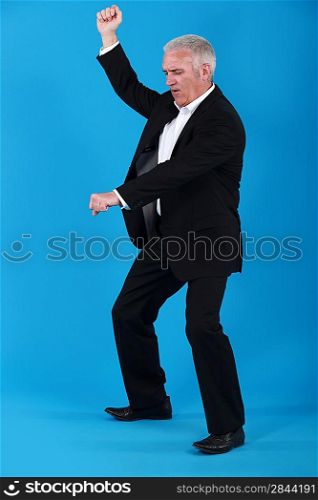 mature businessman dancing
