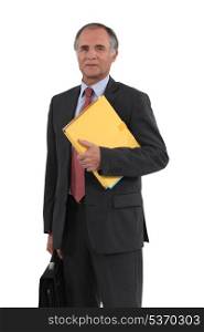Mature businessman holding a folder