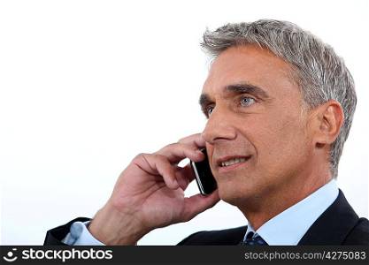 Mature businessman using a cellphone