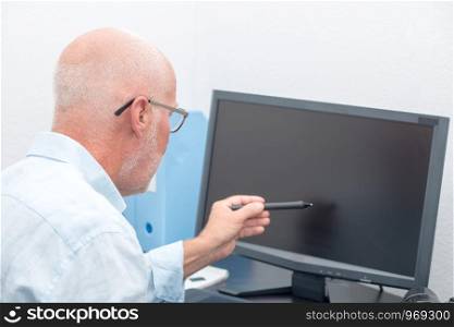mature businessman working with the computer