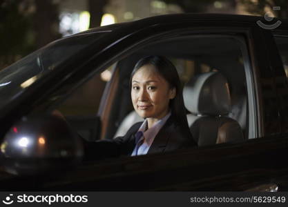 Mature Businesswoman Driving Car