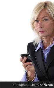 Mature businesswoman with a cellphone