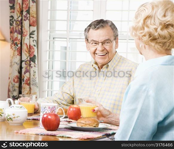 Mature Caucasian couple having breakfast together.
