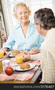 Mature Caucasian couple having breakfast together.