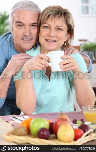 mature couple all smiles at breakfast